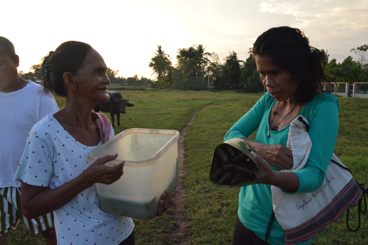 Villagers sell snacks to earn some income