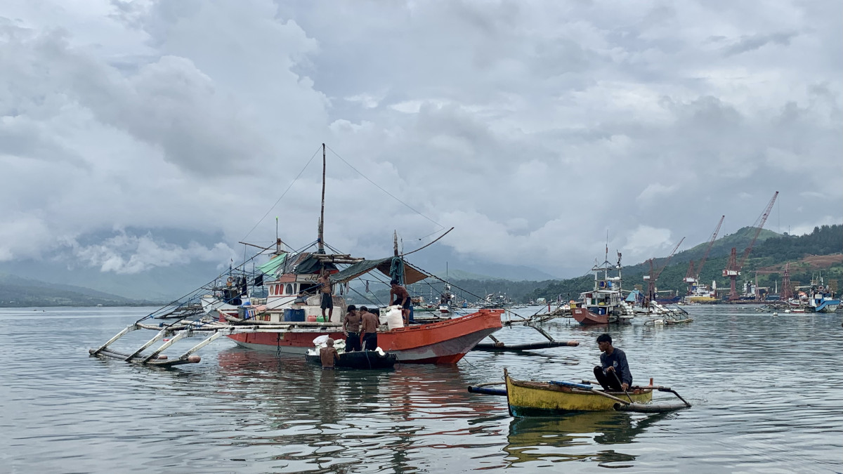 Fishermen sail to Scarborough Shoal on board a large vessel called a “mother boat,” which carry smaller “service” boats that they use to get inside the lagoon. (Photo by Joanna Rose Aglibot)